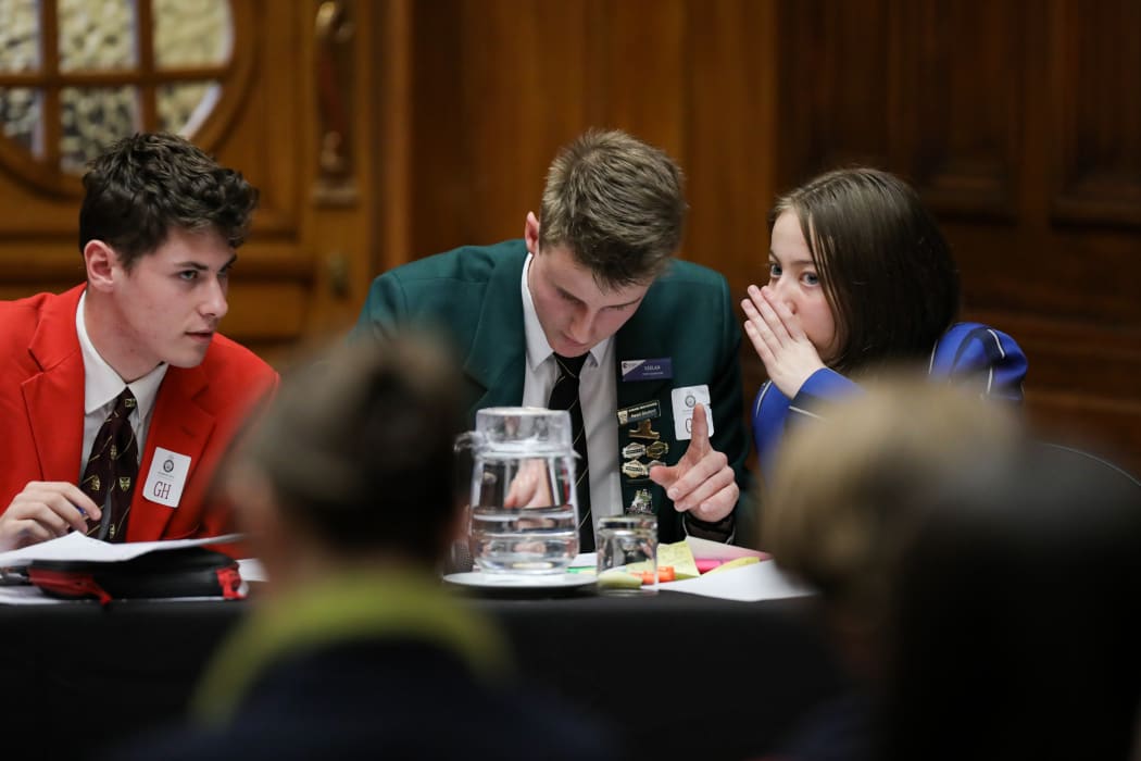 Emilie Horsfall (Havelock North High School) shares a rebuttal idea with Keelan Heesterman