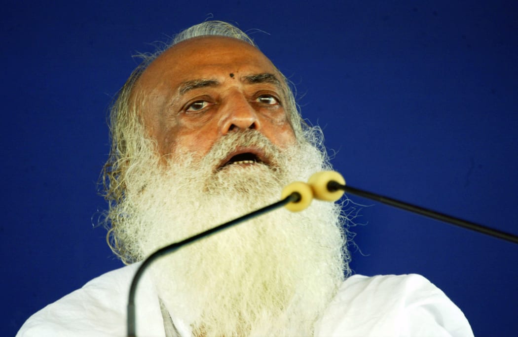 In this file photo taken on July 18, 2008 Indian spiritual leader Asaram Bapu addresses supporters at the sect's ashram (Spiritual Centre) on the outskirts of Ahmedabad.
