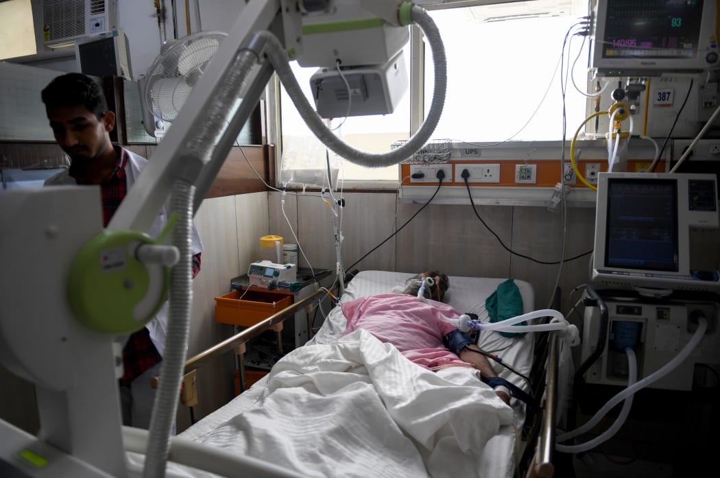 An Indian patient being cared for with a ventilator to help with breathing.