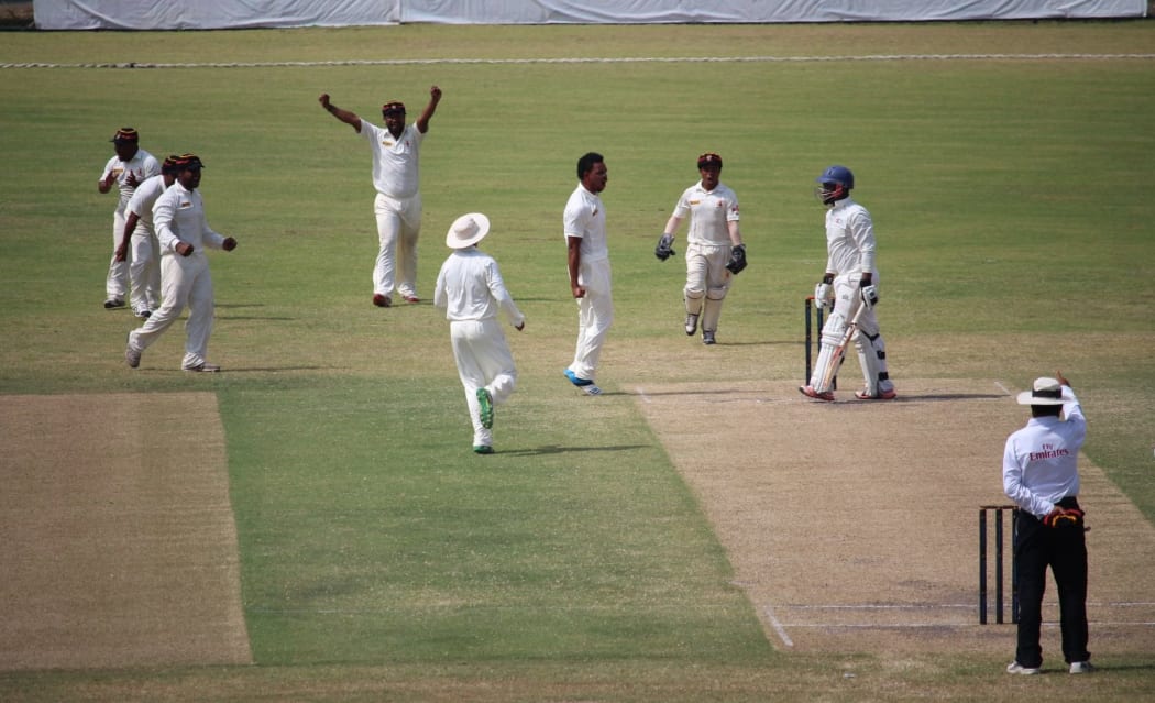 PNG celebrate another Namibian wicket.