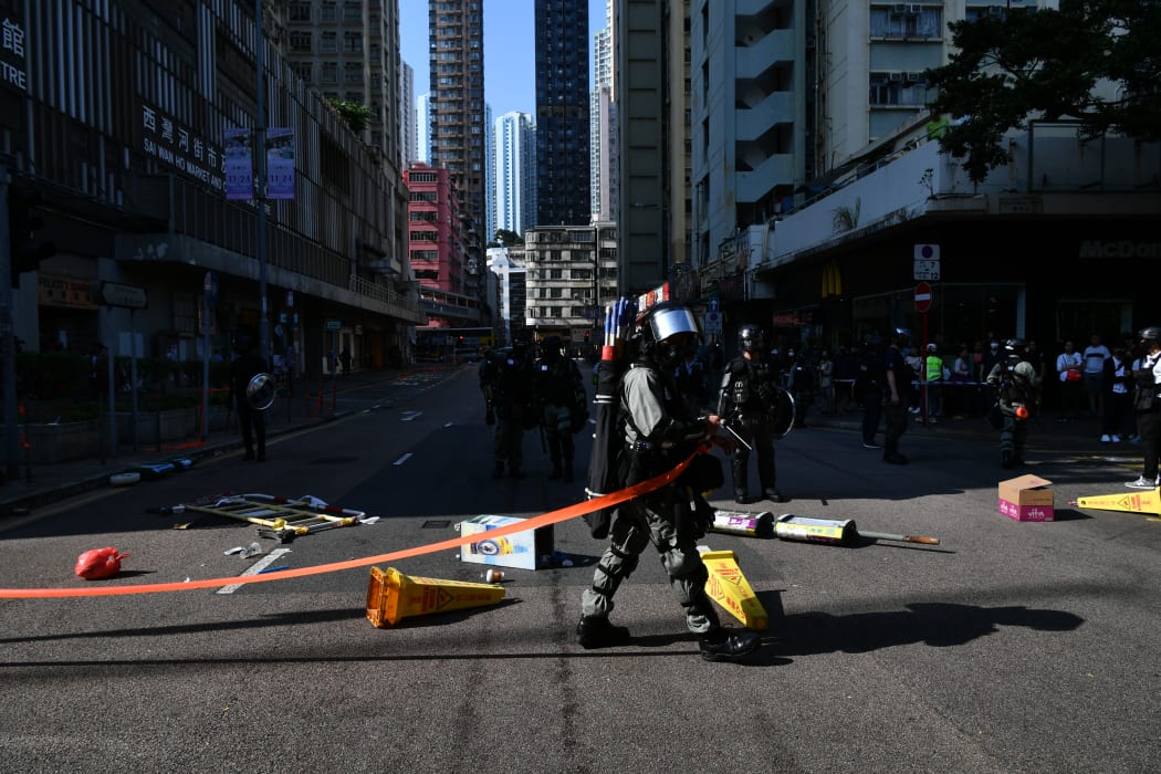Policeman cordon off the site where pro-democracy protesters were shot by a policeman in Hong Kong.