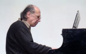 Ukrainian composer Valentin Silvestrov playing the piano