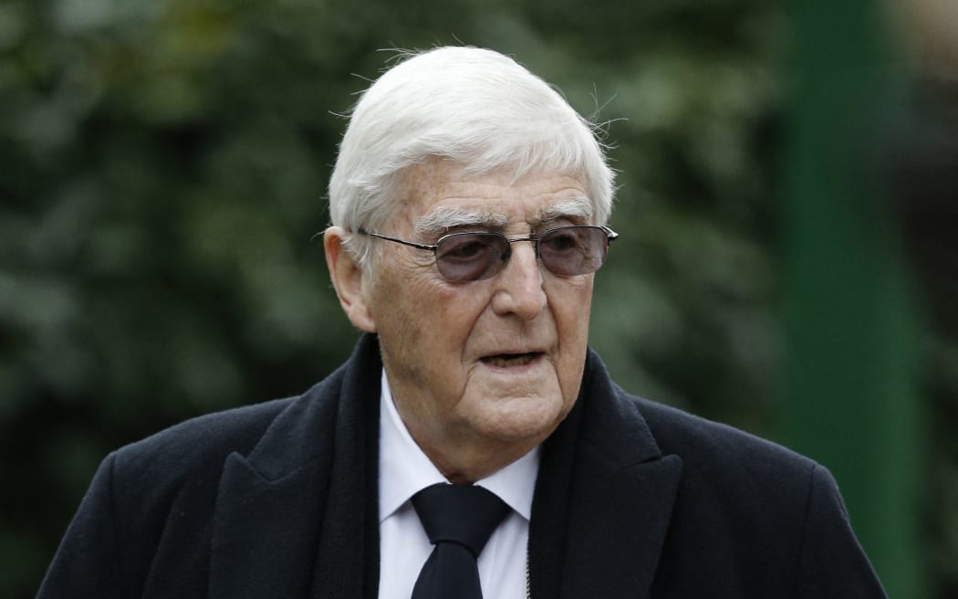 Sir Michael Parkinson attends the funeral service of British comedian Ronnie Corbett in Croydon on April 18, 2016. Ronnie Corbett, one of Britain's most popular comedians, best known for "The Two Ronnies", his double-act with Ronnie Barker, died on March 31,  aged 85. (Photo by ADRIAN DENNIS / AFP)