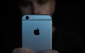 A man is seen using an iPhone on November 2, 2017. Concerns have been raised about Apple's new iPhone X and it's front facing camera with face recognition.
