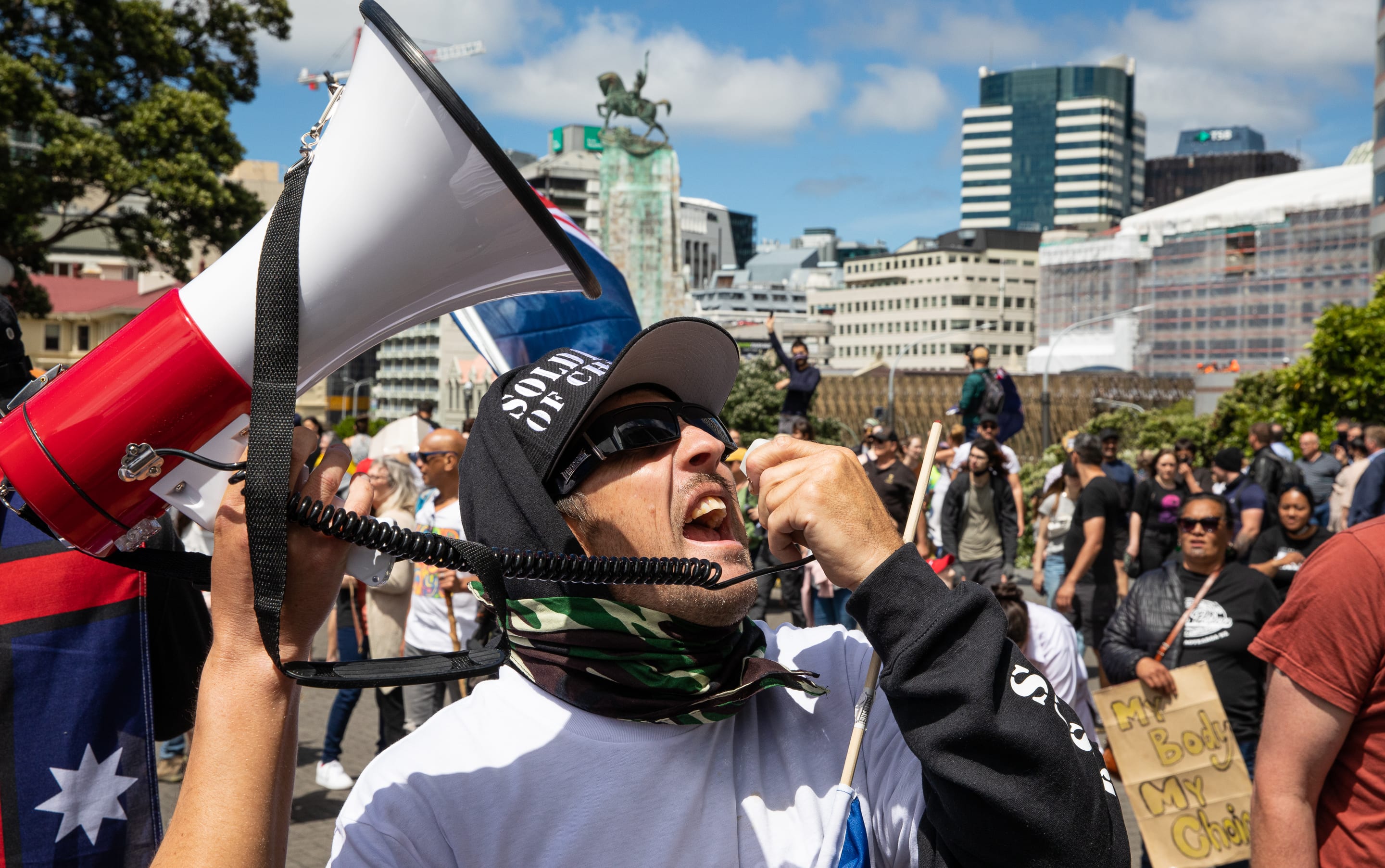 Did I mention loud? A protestor borrows someone's loud hailer to berate the front wall of the Beehive.