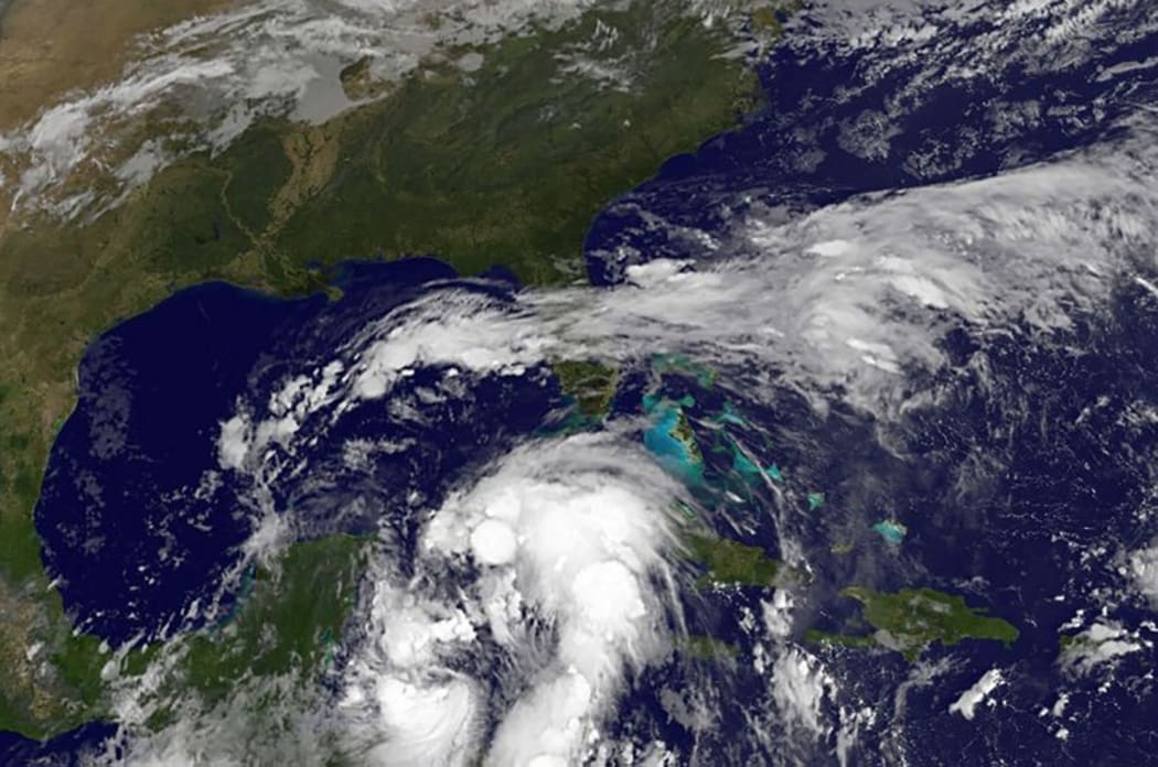 A satellite image shows tropical storm activity along the coast of Central America.