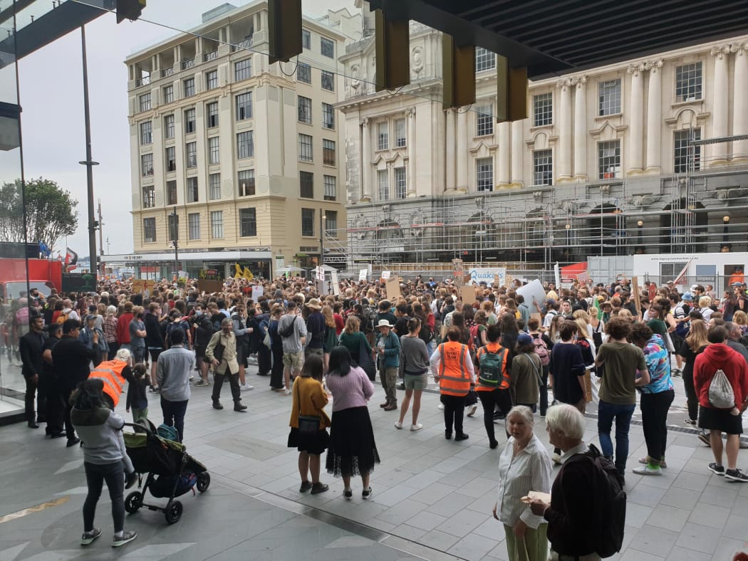 Chants of "Climate action,  NOW" resound at the Auckland march.