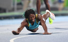 The Bahamas' Shaunae Miller crosses the finish line to win the 400m final at Rio on 15 August (Brazil time).