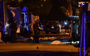 Vancouver police investigate a crime scene after a man drove into pedestrians at the annual Lapu Lapu festival celebrating Filipino culture, at East 43rd Avenue and Fraser, in the south of Vancouver .