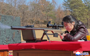 This picture taken on February 27, 2026 and released by North Korea's official Korean Central News Agency (KCNA) via KNS on February 28, 2026 shows North Korean leader Kim Jong Un's daughter Kim Ju Ae firing a new sniper rifle, at an undisclosed place in North Korea. (Photo by KCNA VIA KNS / AFP) / South Korea OUT / SOUTH KOREA OUT / ---EDITORS NOTE--- RESTRICTED TO EDITORIAL USE - MANDATORY CREDIT "AFP PHOTO/KCNA VIA KNS" - NO MARKETING NO ADVERTISING CAMPAIGNS - DISTRIBUTED AS A SERVICE TO CLIENTS
THIS PICTURE WAS MADE AVAILABLE BY A THIRD PARTY. AFP CAN NOT INDEPENDENTLY VERIFY THE AUTHENTICITY, LOCATION, DATE AND CONTENT OF THIS IMAGE. /