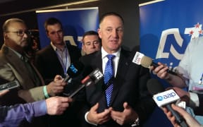 John Key talking to media after his leader's speech.