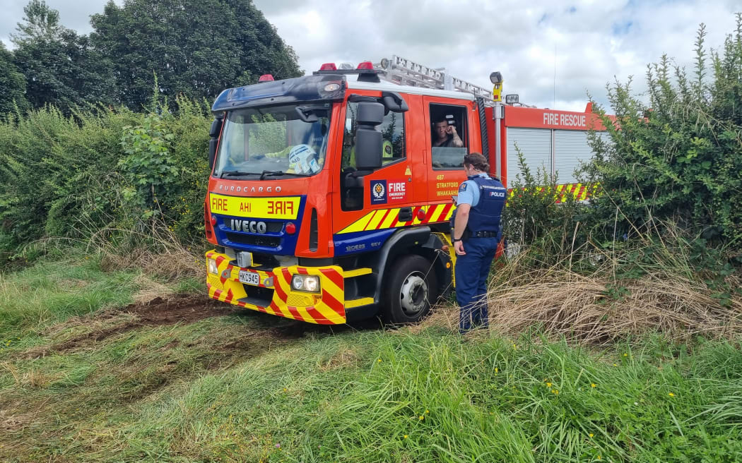 A fire truck at the paddock where a microlight has crashed.