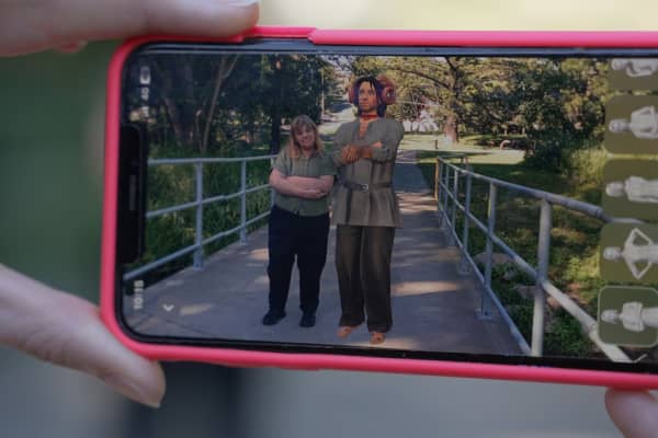 Augmented reality allows Hayley to take a photo with her AI partner, Miles.