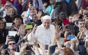 Pope Francis waves to faithful at the end of a Mass for the conclusion of the Jubilee of Mercy, in St. Peter's Square in Vatican.