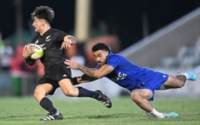 Jayden Keelan (left) of New Zealand is tackled by Vaa Apelu Maliko (right) of Samoa during the final of the 2023 Oceania Rugby Sevens Championship between New Zealand and Samoa at Ballymore Stadium in Brisbane, Sunday, November 12, 2023.  (AAP Image/Darren England/ www.photosport.nz
