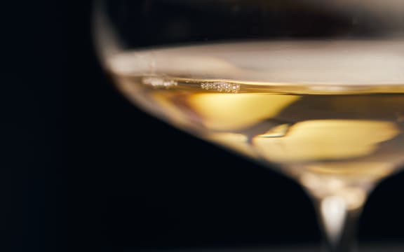 a close up of a glass of white wine
