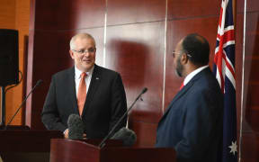 Scott Morrison (left) speaks to Charlot Salwai's in Vanuatu.