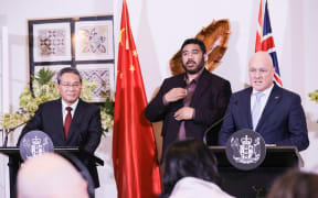 China's Premier Li Qiang and New Zealand Prime Minister Christopher Luxon speak at the podium during a joint news conference on 13 June, 2024.