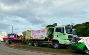 Trucks, taxis blockading the entrance to the main fuel depot in Ducos, Nouméa industrial zone.