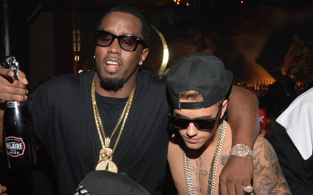 Sean 'Diddy' Combs and Justin Bieber attend Ciroc party at Vanquish Lounge on 5 February, 2014 in Atlanta, Georgia.