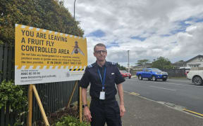 Mike Inglis, Biosecurity Commissioner North, with a new sign showing the secured fruit fly area.