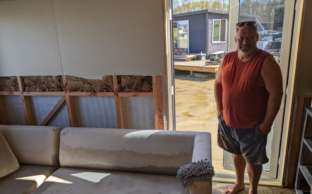 Bill Bartley is helping neighbours Aroha and Abel clean their property.