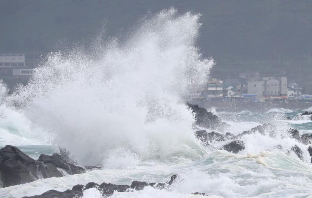 High waves batter the coastline in Seogwipo on the island of Jeju on August 25, as Typhoon Bavi approaches South Korea.