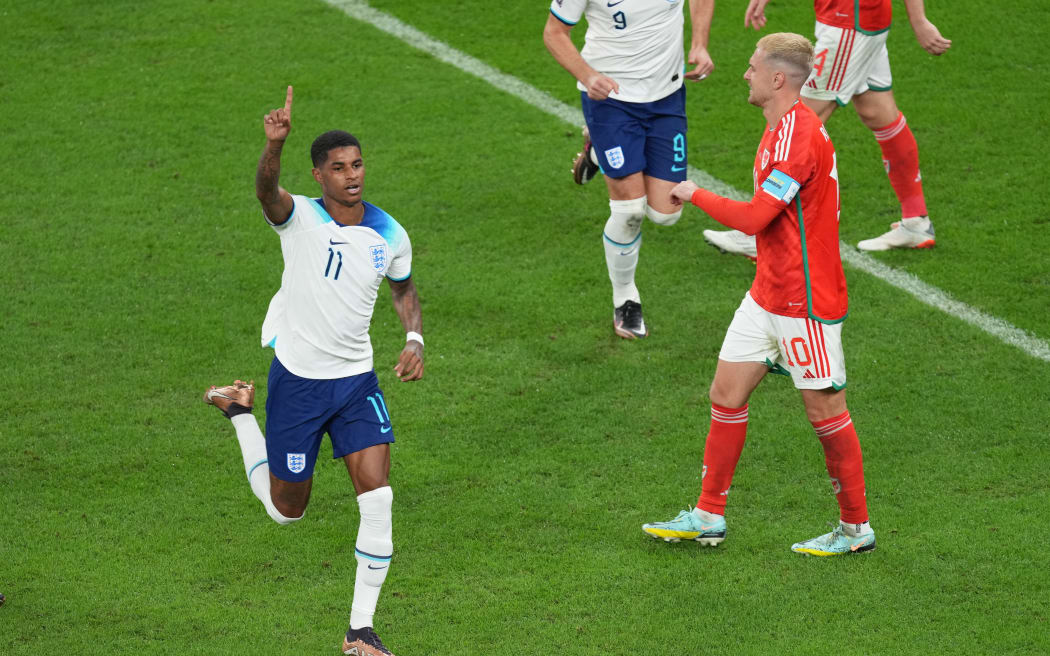 England forward Marcus Rashford celebrates with teammates after scoring a goal during the FIFA World Cup Qatar 2022 Group B match between Wales and England at Ahmed bin Ali Stadium in Al-Rayyan, Qatar on 29 November, 2022.