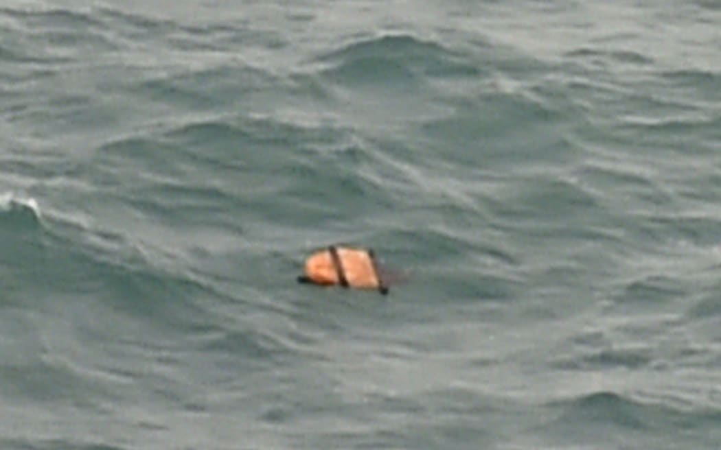Floating debris spotted in the same area as other items being investigated by Indonesian authorities as possible objects from missing AirAsia flight.
