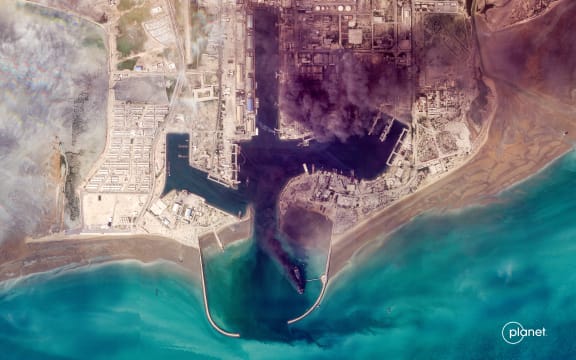 This handout satellite image taken by 2026 Planet Labs PBC on March 2, 2026 shows smoke billowing following an explosion from the port of Bandar Abbas along the strait of Hormuz. The United States and Israel launched strikes against Iran on February 28, killing Iran's supreme leader and top military leaders, prompting authorities to retaliate with strikes on Israel and US bases across the Gulf. (Photo by 2026 Planet Labs PBC / AFP) / RESTRICTED TO EDITORIAL USE - MANDATORY CREDIT "AFP PHOTO / © 2026 PLANET LABS PBC " - HANDOUT - NO MARKETING NO ADVERTISING CAMPAIGNS - DISTRIBUTED AS A SERVICE TO CLIENTS
