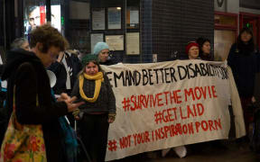Esther Woodbury (middle) at the protest.
