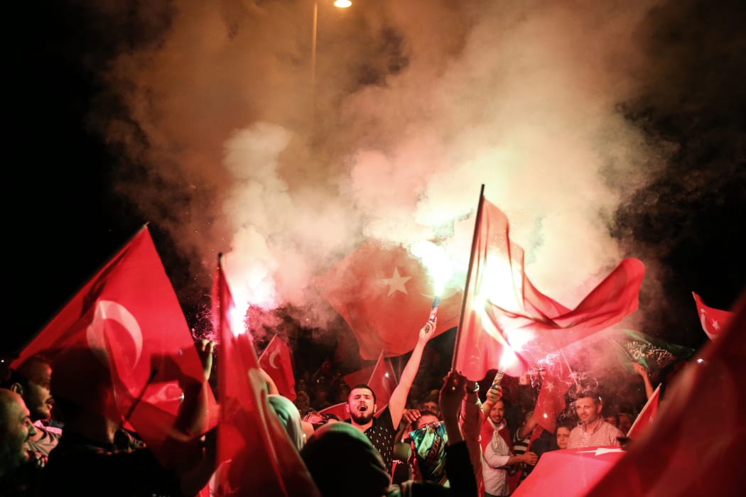 Pro-Erdogan supporters gather in front of his residence at Kisikli Neighborhood in Istanbul.