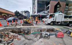 Work being done on a broken pipe in Wellington CBD which led to a water outage for at least 100 properties in the area.
