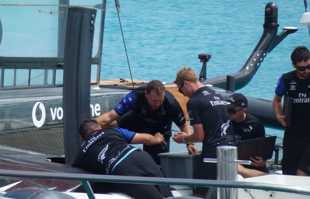 Team New Zealand work on their daggerboard
