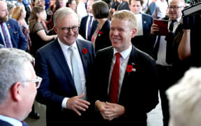 Australian Prime Minister Anthony Albanese  and New Zealand Prime Minister Chris Hipkins chat after a Citizenship ceremony in Brisbane.