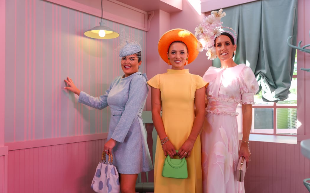 MELBOURNE, AUSTRALIA - NOVEMBER 07: Racegoers pose for a photo in the Park precinct during Melbourne Cup Day at Flemington Racecourse on November 07, 2023 in Melbourne, Australia. (Photo by Asanka Ratnayake/Getty Images)
