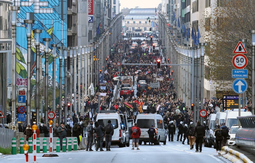 Demonstrators in Brussels, Belgium, protest at the use of restrictions aimed at stopping the spread of Covid-19, 21 November 2021.