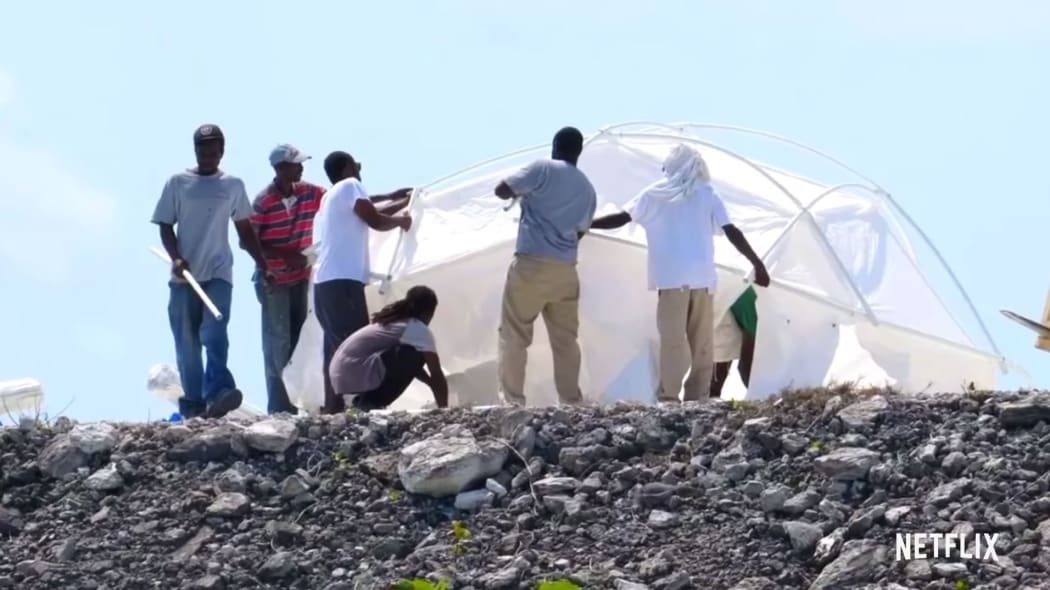 Workers erecting the 'luxury' tents at Fyre Festival (which turned out to be leftover hurricane tents)