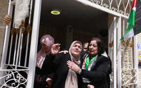 Relatives mourn during the funeral of Omar Hamed, who was killed during clashes with Israeli settlers the day before, in the village of Baytin, near Ramallah in the Israeli-occupied West Bank, on April 14, 2024. (Photo by Jaafar ASHTIYEH / AFP)