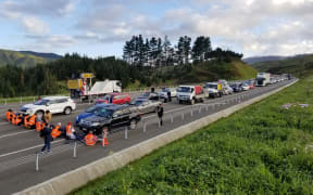 Protesters block traffic on Transmission Gully, Wellington, on 19 October 2022.