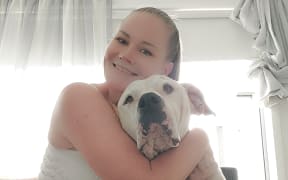 Dee-Anna Kitto with her pet dog called Baby, who went missing for three years.