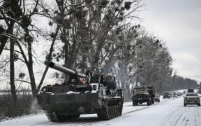 An Ukrainian tank rolls along a main road on 8 March 2022.