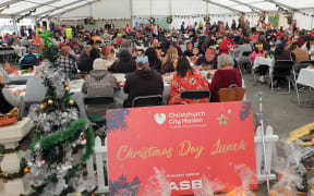 Christchurch's City Mission Christmas lunch turnout had less people than expected, after rain poured down.