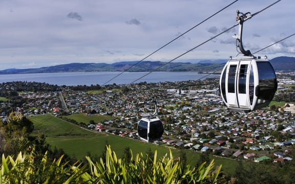 Riding cable car above Rotorua lake and city, in the centre of North Island of New Zealand