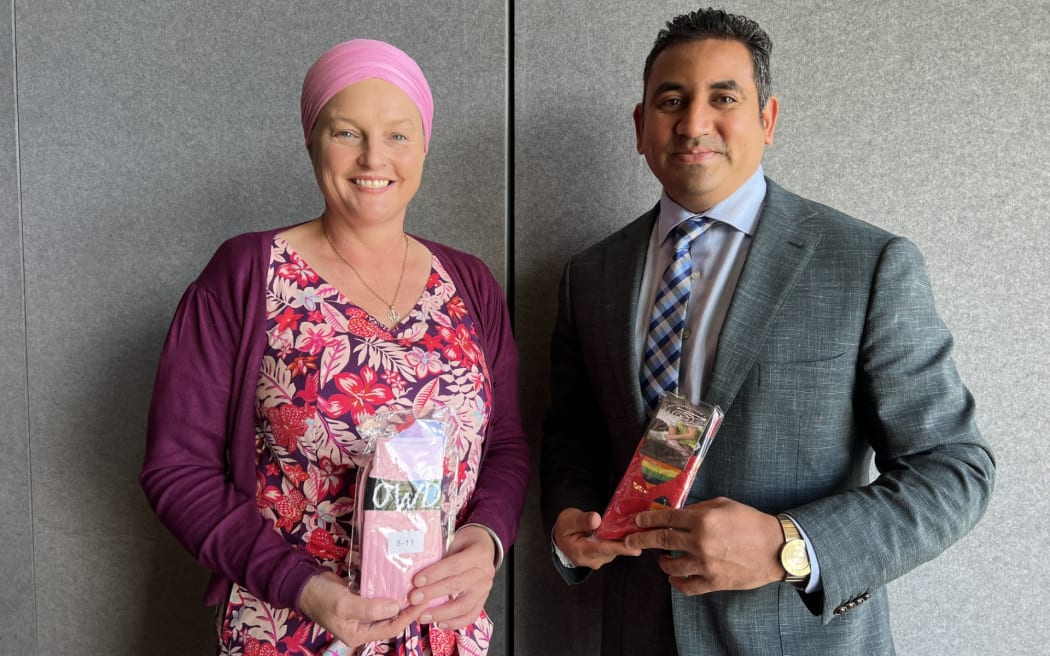 Meredith Stewart (left) and Arish Naresh from Tairawhiti Multicultural Council holding their "odd socks" which symbolise diversity and people's uniqueness.