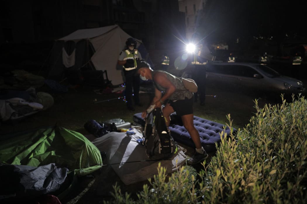 Police ripped down tents at the protest in the early hours of the morning.