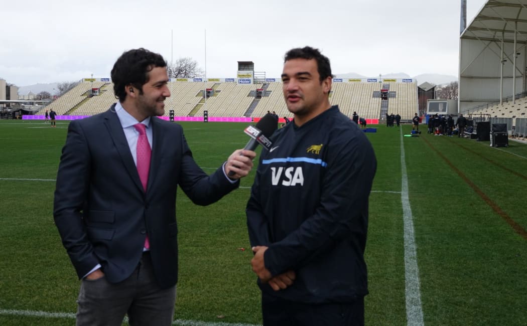 Argentina captain Agustin Creevy talks to a reporter