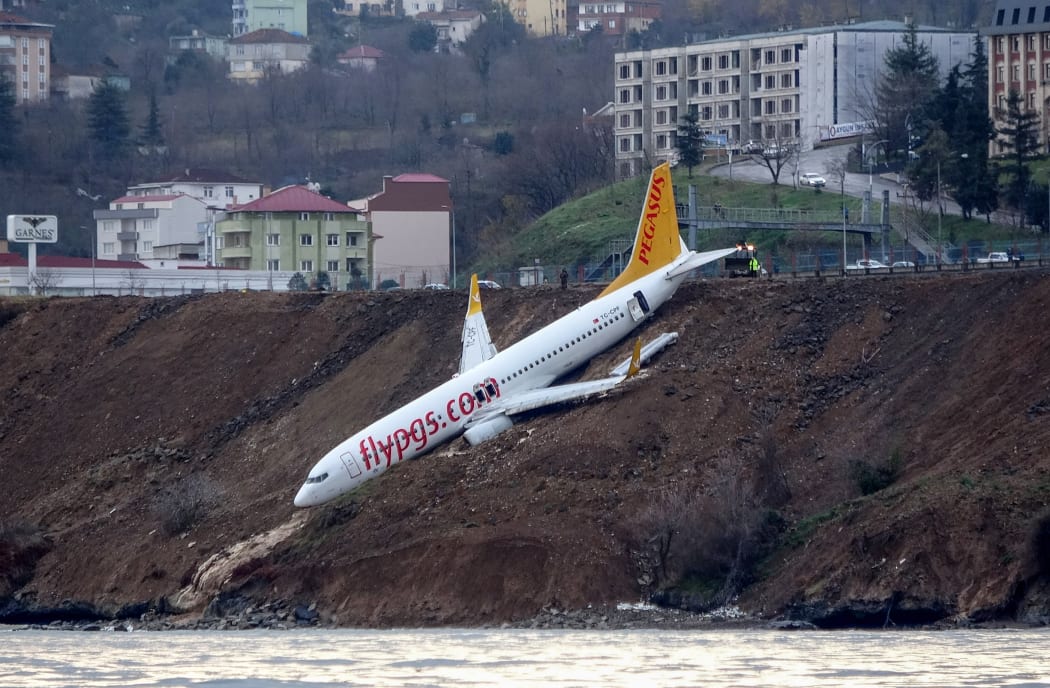 A Pegasus Airlines flight skidded off the runway of a Turkish coastal airport and plunged down a steep slope on the edge of the Black Sea.