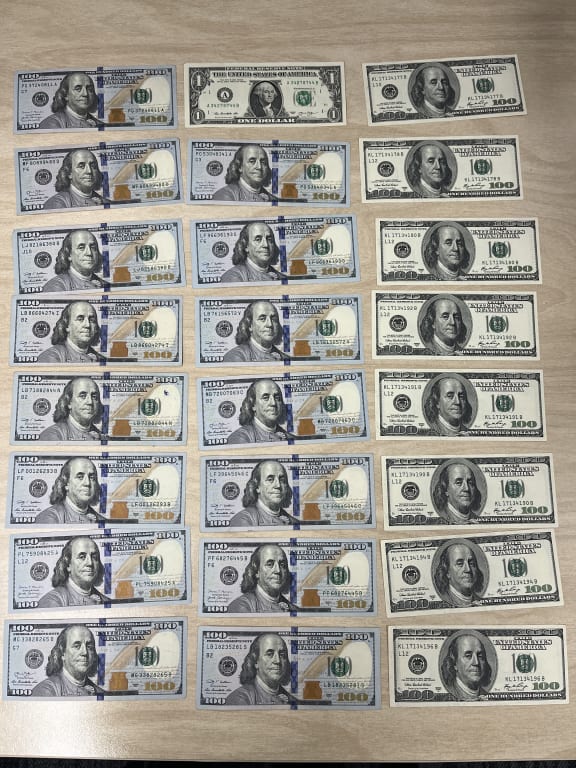 Money seized from police in relation to an alleged blessing scam.