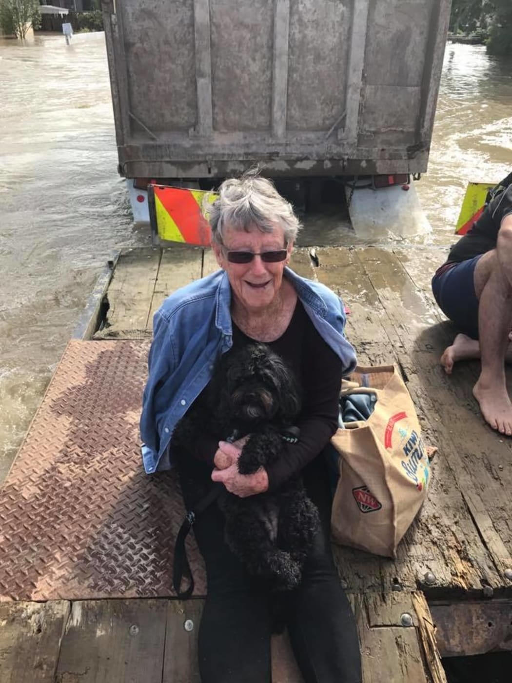Ursula Mayo and her dog Poppy were rescued from floodwaters by Mrs Mayo's son-in-law Tautini Hahipene.